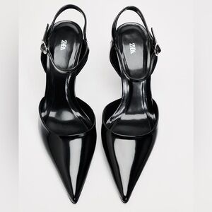 ZARA
Black Heeled slingback pumps. Pointed toe. Buckled ankle strap closure.
